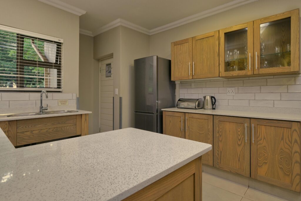 Stylish kitchen interior featuring wooden cabinetry and modern appliances.