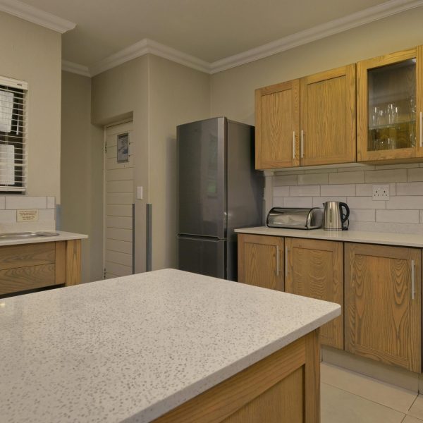 Stylish kitchen interior featuring wooden cabinetry and modern appliances.